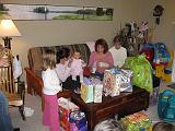2006-11-19.seren.1yr_birthday.opening_presents.1.nessa-seren-snyder.livonia.mi.us.jpg