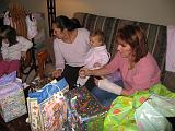 2006-11-19.seren.1yr_birthday.opening_presents.2.nessa-seren-snyder.livonia.mi.us.jpg