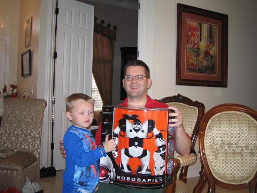 2004-12-25.opening_presents.kevin-snyder-ethan.1.christmas.venice.fl.us 